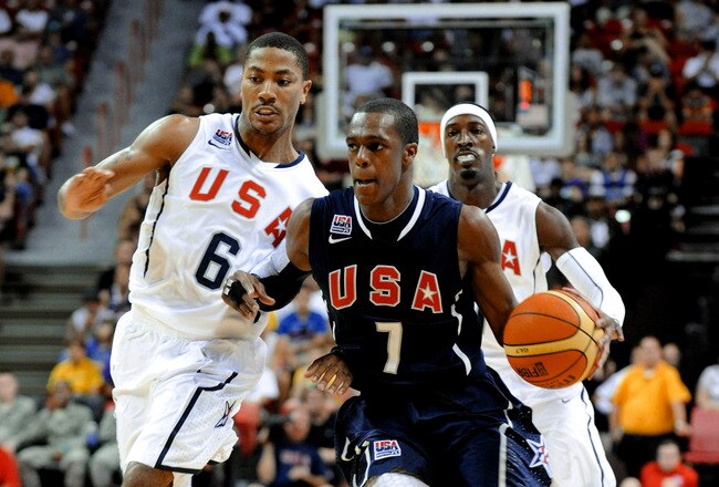LAS VEGAS - JULY 24:  Rajon Rondo #7 of the 2010 USA Basketball Men's National Team dribbles in front of Derrick Rose #6 and Gerald Wallace #7 during a USA Basketball showcase at the Thomas & Mack Center on July 24, 2010 in Las Vegas, Nevada.  (Photo by Ethan Miller/Getty Images)
