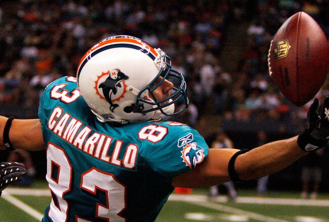 NEW ORLEANS - SEPTEMBER 03:  Greg Camarillo #83 of the Miami Dolphins tries to catch a pass over Malcolm Jenkins #27 of the New Orleans Saints at the Louisiana Superdome on September 3, 2009 in New Orleans, Louisiana.  (Photo by Chris Graythen/Getty Images)