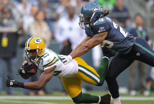 SEATTLE - AUGUST 21:  Wide receiver Greg Jennings #85 of the Green Bay Packers makes a catch during the preseason game against Earl Thomas #29 of the Seattle Seahawks at Qwest Field on August 21, 2010 in Seattle, Washington. (Photo by Otto Greule Jr/Getty Images)