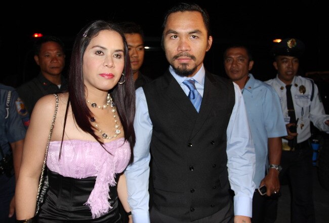 GENERAL SANTOS, PHILIPPINES - MAY 15:  World welterweight boxing champion Manny Pacquiao and wife Jinkee Pacquiao arrive at the KCC Mall on May 15, 2010 in General Santos, Philippines. Pacquiao was there to celebrate his election on becoming a member of House of Representatives in the 15th Congress of the Philippines. Pacquiao established the record of being the first active boxer to become a congressman in the Philippines.  (Photo by Jeoffrey Maitem/Getty Images)