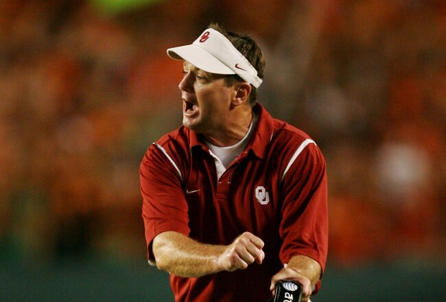 MIAMI GARDENS, FL - OCTOBER 3:   Head coach Bob Stoops of the Oklahoma Sooners signals to the referee in the second quarter of the game against the Miami Hurricanes on October 3, 2009 at Landshark Stadium in Miami Gardens, Florida. (Photo by Doug Benc/Getty Images)