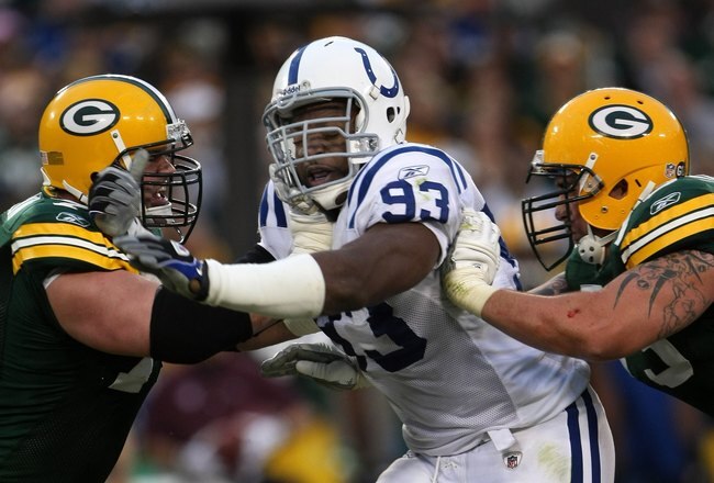 GREEN BAY, WI - OCTOBER 19:  Defensive end Dwight Freeney #93 of the Indianapolis Colts and tackle Chad Cllifton #76 of the Green Bay Packers battle on October 19, 2008 at Lambeau Field in Green Bay Wisconsin. The Packers won 34-14.  (Photo by Stephen Dunn/Getty Images)