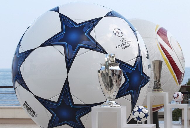 MONACO - AUGUST 26:  Adidas balls on show alongside the three main European club trophies, the Champions League, Europa League and Super Cup during the UEFA Champions League Group Stage draw at the Grimaldi Forum on August 26, 2010 in Monaco, Monaco.  (Photo by Michael Steele/Getty Images)