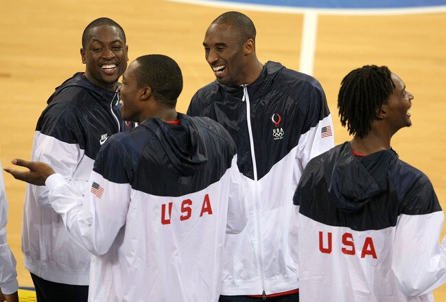 BEIJING - AUGUST 24:  (L-R)  Dwyane Wade #9, Dwight Howard #11,  Kobe Bryant #10 and Chris Bosh #12 of the United States share a laugh before receiving the gold medal in the medal ceremony for men's basketball during Day 16 of the Beijing 2008 Olympic Games at the Beijing Olympic Basketball Gymnasium on August 24, 2008 in Beijing, China.  (Photo by Nick Laham/Getty Images)