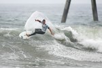 HUNTINGTON BEACH, CA - JULY 24:  Andy Irons (Hawaii) turns off the top in Heat 4 of the Men's Round of 24 during the 2009 Hurley U.S. Open of Surfing on July 24, 2009 in Huntington Beach, California.  (Photo by Victor Decolongon/Getty Images)