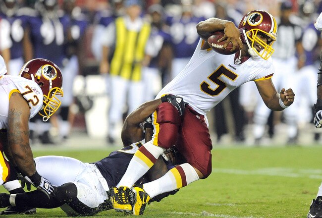 LANDOVER, MD - AUGUST 21:  Donovan McNabb #5 of the Washington Redskins is tackled during the preseason game by Terrell Suggs #55 of the Baltimore Ravens at FedExField on August 21, 2010 in Landover, Maryland.  (Photo by Greg Fiume/Getty Images)