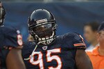CHICAGO - AUGUST 21: Anthony Adams #95 of the Chicago Bears warms-up before a preseason game against the Oakland Raiders at Soldier Field on August 21, 2010 in Chicago, Illinois. The Raiders defeated the Bears 32-17.  (Photo by Jonathan Daniel/Getty Images)