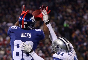 EAST RUTHERFORD, NJ - DECEMBER 06:  Hakeem Nicks #88 of the New York Giants makes a 21-yard touchdown reception in the second quarter against Terence Newman #41 of the Dallas Cowboys at Giants Stadium on December 6, 2009 in East Rutherford, New Jersey. The Giants won 31-24.  (Photo by Jim McIsaac/Getty Images)