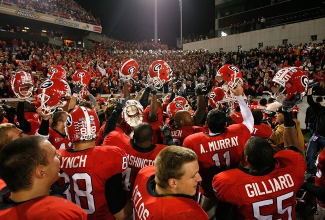 ATLANTA - NOVEMBER 28:  The Georgia Bulldogs celebrate their 30-24 win over the Georgia Tech Yellow Jackets at Bobby Dodd Stadium on November 28, 2009 in Atlanta, Georgia.  (Photo by Kevin C. Cox/Getty Images)