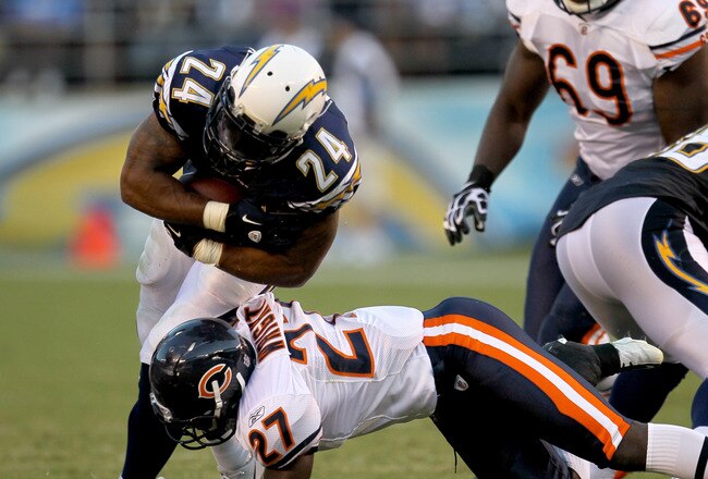 SAN DIEGO - AUGUST 14:  Running back Ryan Mathews #24 of the San Diego Chargers carries for a first down on fourth and one before being tackled by safety Major Wright #27 of the Chicago Bears on August 14, 2010 at Qualcomm Stadium in San Diego, California.  (Photo by Stephen Dunn/Getty Images)