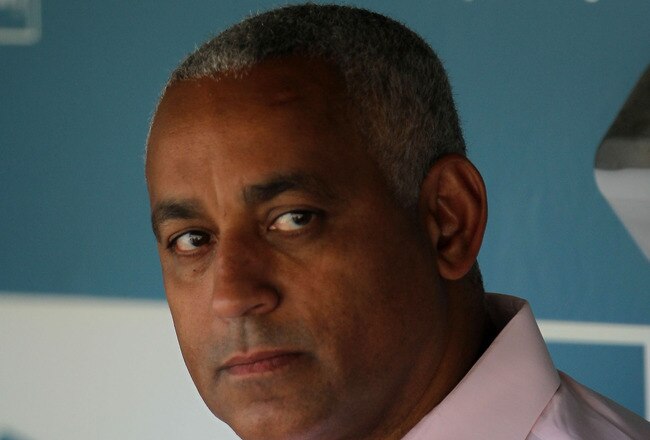 LOS ANGELES, CA - JULY 24:  New York Mets general manager Omar Minaya looks on from the dugout prior to the start of the game against the Los Angeles Dodgers at Dodger Stadium on July 24, 2010 in Los Angeles, California.  (Photo by Jeff Gross/Getty Images)