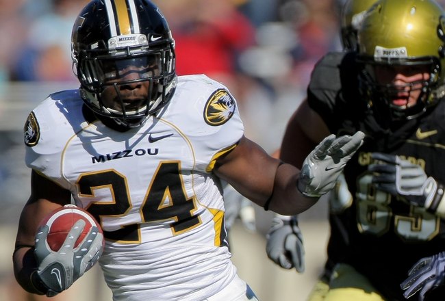 BOULDER, CO - OCTOBER 31:  Derrick Washington #24 of the Missouri Tigers rushes against the Colorado Buffaloes at Folsom Field on October 31, 2009 in Boulder, Colorado. Missouri defeated Colorado 36-17.  (Photo by Doug Pensinger/Getty Images)