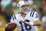 GREEN BAY, WI - AUGUST 26: Peyton Manning #18 of the Indianapolis Colts prepares to throw a pass against the Green Bay Packers during a preseason game at Lambeau Field on August 26, 2010 in Green Bay, Wisconsin.  The Packers defeated the Colts 59-24. (Photo by Jonathan Daniel/Getty Images)