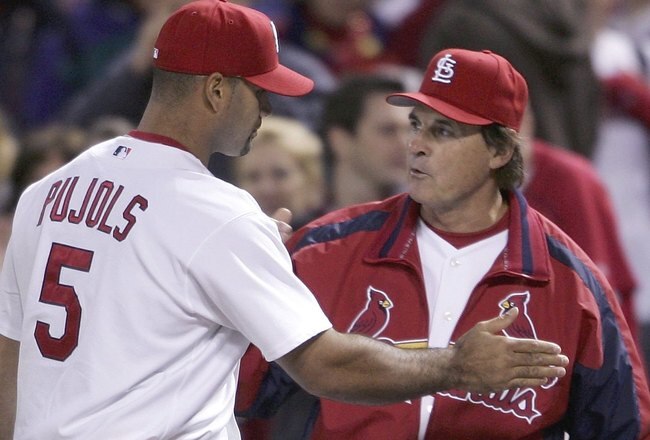 ST. LOUIS - MAY 12:  Manager Tony LaRussa #10 of the St. Louis Cardinals celebrates with Albert Pujols #5 after the game against the Arizona Diamondbacks on May 12, 2006 at Busch Stadium in St. Louis, Missouri. The Cardinals defeated the D-Backs 5-3.  (Photo by Elsa/Getty Images)