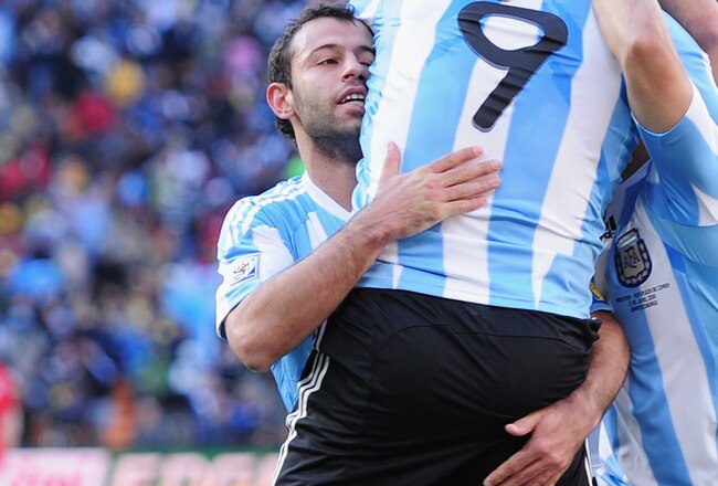JOHANNESBURG, SOUTH AFRICA - JUNE 17:  Javier Mascherano and Sergio Aguero of Argentina celebrate the third goal by Gonzalo Higuain (#9) of Argentina during the 2010 FIFA World Cup South Africa Group B match between Argentina and South Korea at Soccer City Stadium on June 17, 2010 in Johannesburg, South Africa.  (Photo by Clive Mason/Getty Images)