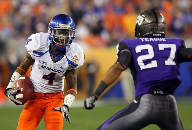 GLENDALE, AZ - JANUARY 04:  Titus Young #4 of the Boise State Broncos runs after a catch against Jason Teague #27 of the TCU Horned Frogs during the Tostitos Fiesta Bowl at the Universtity of Phoenix Stadium on January 4, 2010 in Glendale, Arizona.  (Photo by Christian Petersen/Getty Images)