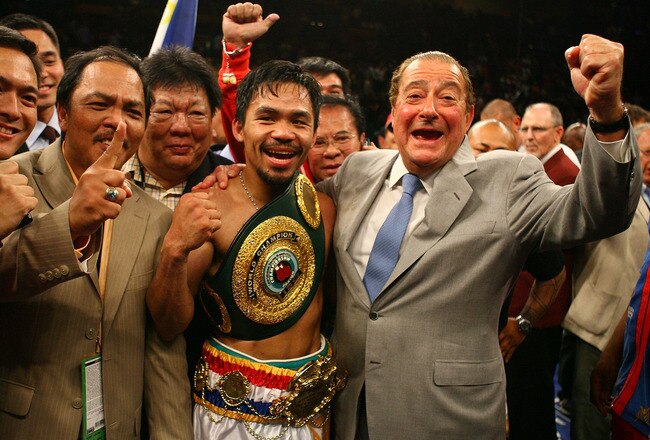 LAS VEGAS - MAY 02:  Manny Pacquiao of the Philippines celebrates with promoter Bob Arum after knocking down Ricky Hatton of England in the second round during their junior welterweight title fight at the MGM Grand Garden Arena May 2, 2009 in Las Vegas, Nevada.  (Photo by Al Bello/Getty Images)