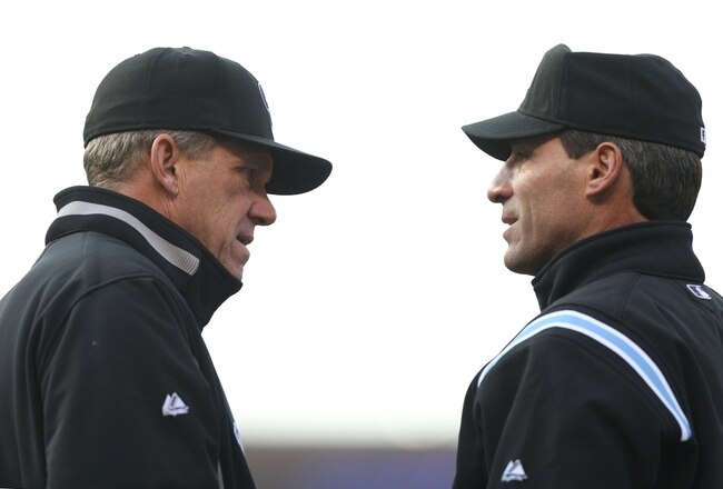 DENVER - OCTOBER 11:  Manager Jim Tracy #4 of the Colorado Rockies pitches against the Philadelphia Phillies in Game Four of the NLDS during the 2009 MLB Playoffs at Coors Field on October 12, 2009 in Denver, Colorado.  (Photo by Jed Jacobsohn/ Getty Images)