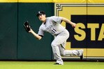 HOUSTON - MAY 19:  Right fielder Brad Hawpe #11 of the Colorado Rockies makes a catch on a dipping fly ball against the Houston Astros at Minute Maid Park on May 19, 2010 in Houston, Texas.  (Photo by Bob Levey/Getty Images)