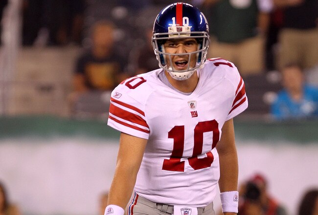 EAST RUTHERFORD, NJ - AUGUST 16:  Eli Manning #10 of the New York Giants points to the ground in the first quarter during their game against the New York Jets at New Meadowlands Stadium on August 16, 2010 in East Rutherford, New Jersey.  (Photo by Nick Laham/Getty Images)