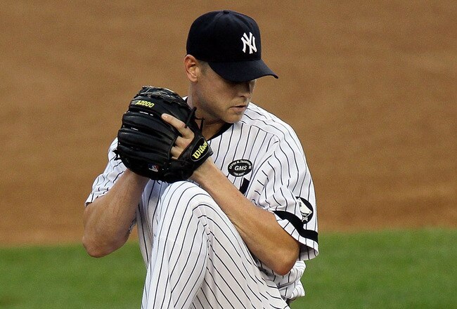 NEW YORK - AUGUST 22:  Kerry Wood #39 of the New York Yankees pitches against the Seattle Mariners on August 22, 2010 at Yankee Stadium in the Bronx borough of New York City.The Yankees defeated the Mariners 10-0.  (Photo by Jim McIsaac/Getty Images)