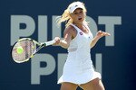 NEW HAVEN, CT - AUGUST 28:  Caroline Wozniacki of Denmark returns a shot to Nadia Petrova of Russia during the final of the Pilot Pen tennis tournament at the Connecticut Tennis Center on August 28, 2010 in New Haven, Connecticut.  (Photo by Matthew Stockman/Getty Images)