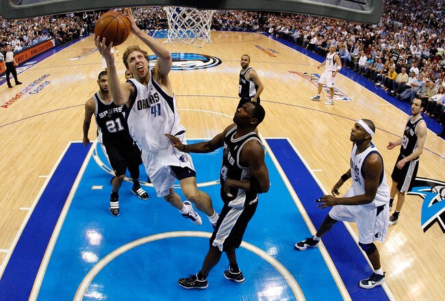 DALLAS - APRIL 27:  Forward Dirk Nowitzki #41 of the Dallas Mavericks takes a shot against Antonio McDyess #34 of the San Antonio Spurs in Game Five of the Western Conference Quarterfinals during the 2010 NBA Playoffs at American Airlines Center on April 27, 2010 in Dallas, Texas. NOTE TO USER: User expressly acknowledges and agrees that, by downloading and or using this photograph, User is consenting to the terms and conditions of the Getty Images License Agreement.  (Photo by Ronald Martinez/Getty Images)