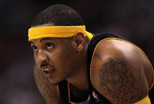 PHOENIX - APRIL 13:  Carmelo Anthony #15 of the Denver Nuggets in action during the NBA game against the Phoenix Suns at US Airways Center on April 13, 2010 in Phoenix, Arizona. The Suns defeated the Nuggets 123-101.  NOTE TO USER: User expressly acknowledges and agrees that, by downloading and or using this photograph, User is consenting to the terms and conditions of the Getty Images License Agreement.  (Photo by Christian Petersen/Getty Images)