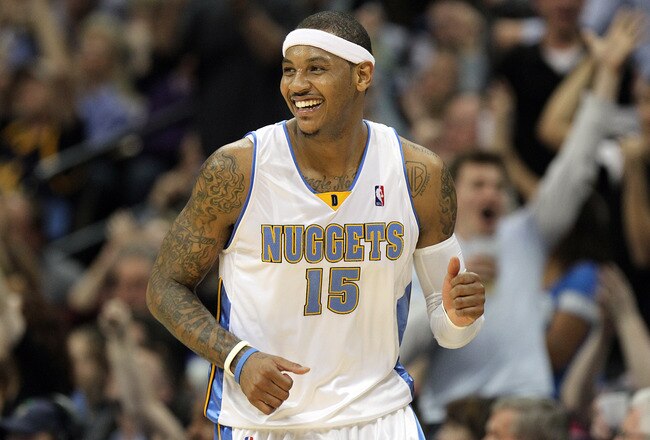 DENVER, CO - APRIL 17 : Carmelo Anthony #15 of the Denver Nuggets celebrates after sinking a shot against the Utah Jazz during the second half of Game One of the Western Conference Quarterfinals of the 2010 NBA Playoffs at the Pepsi Center on April 17, 2010 in Denver, Colorado. The Nuggets won the game 126-113 to take a 1-0 lead in the series. NOTE TO USER: User expressly acknowledges and agrees that, by downloading and/or using this Photograph, user is consenting to the terms and conditions of the Getty Images License Agreement. (Photo by Marc Piscotty/Getty Images)