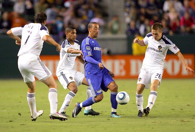 CARSON, CA - AUGUST 28: Chris Klein #7, Sean Franklin #28 and Michael Stephens #26 of the Los Angeles Galaxy surround Ryan Smith #11 of the Kansas City Wizards as Smith passes the ball in the second half during the MLS match at The Home Depot Center on August 28, 2010 in Carson, California. The Wizards defeated the Galaxy 2-0. (Photo by Victor Decolongon/Getty Images)