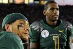 PASADENA, CA - JANUARY 01:  (L-R) Running back LeGarrette Blount #8, quarterback Jeremiah Masoli #9, quarterback Darron Thomas #1, and defensive end Tyrell Irvin #33 of the Oregon Ducks react to a touchdown by the Ohio State Buckeyes during the 96th Rose Bowl game on January 1, 2010 in Pasadena, California.  (Photo by Kevork Djansezian/Getty Images)