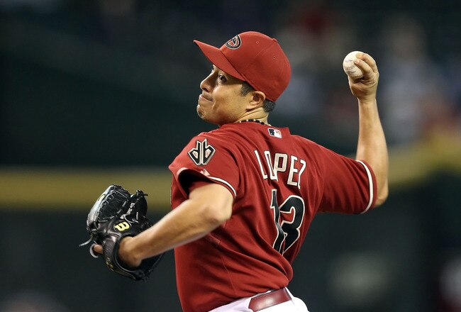 PHOENIX - AUGUST 18:  Starting pitcher Rodrigo Lopez #13 of the Arizona Diamondbacks pitches against the Cincinnati Reds during the Major League Baseball game at Chase Field on August 18, 2010 in Phoenix, Arizona.  The Reds defeated the Diamondbacks 11-7. (Photo by Christian Petersen/Getty Images)