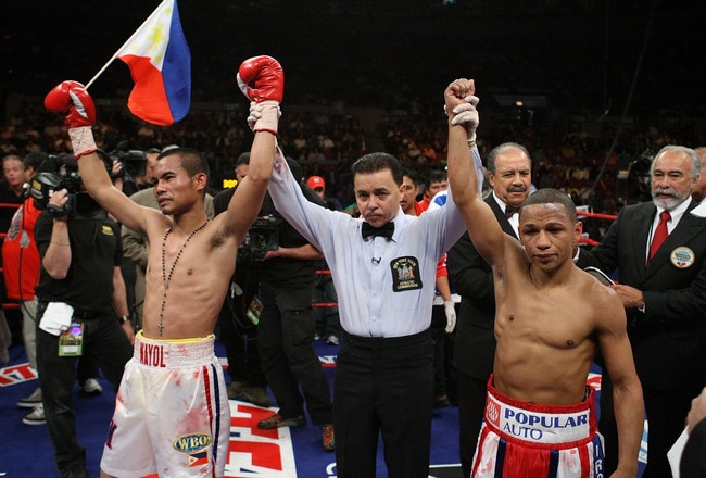 NEW YORK - JUNE 13:  Rodel Mayol and Ivan Calderon react to a draw stopped in the sixth round by a clash of heads in the fourth round during their WBO Mini Flyweight title fight at Madison Square Garden on June 13, 2009 in New York City.  The head butt resulted in a Calderon cut and was forced to be stopped in the sixth round and the fight was called a draw.  (Photo by Al Bello/Getty Images)