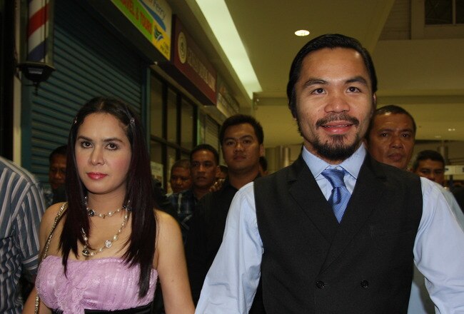 GENERAL SANTOS, PHILIPPINES - MAY 15:  World welterweight boxing champion Manny Pacquiao and wife Jinkee Pacquiao arrive at the KCC Mall on May 15, 2010 in General Santos, Philippines. Pacquiao was there to celebrate his election on becoming a member of House of Representatives in the 15th Congress of the Philippines. Pacquiao established the record of being the first active boxer to become a congressman in the Philippines.  (Photo by Jeoffrey Maitem/Getty Images)