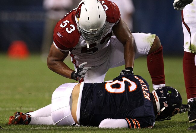 CHICAGO - AUGUST 28: Clark Haggans #53 of the Arizona Cardinals kneels over Jay Cutler #6 of the Chicago Bears after a sack during a preseason game at Soldier Field on August 28, 2010 in Chicago, Illinois. The Cardinals defeated the Bears 14-9. (Photo by Jonathan Daniel/Getty Images)