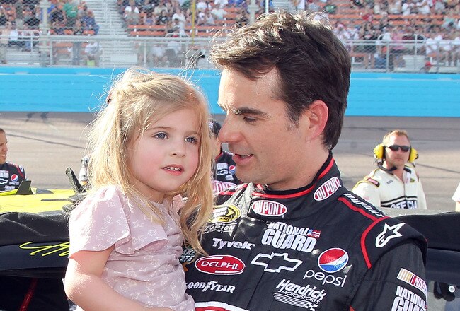 PHOENIX - APRIL 10:  Jeff Gordon, driver of the #24 DuPont Chevrolet, holds daughter Ella Sophia Gordon prior to the NASCAR Sprint Cup Series SUBWAY Fresh Fit 600 at Phoenix International Raceway on April 10, 2010 in Phoenix, Arizona.  (Photo by Christian Petersen/Getty Images)