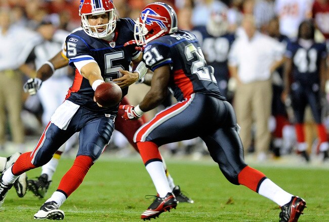 LANDOVER, MD - AUGUST 13:  Trent Edwards #5 of the Buffalo Bills hands the ball off to C.J. Spiller #21 during the preseason game against the Washington Redskins at FedEx Field on August 13, 2010 in Landover, Maryland.  (Photo by Greg Fiume/Getty Images)