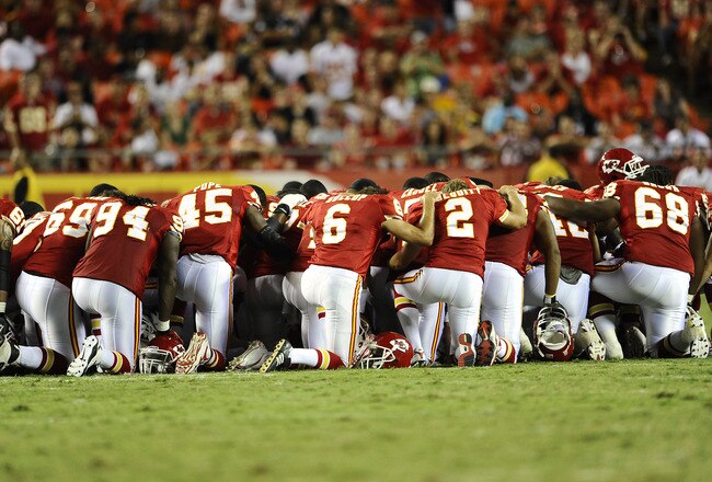 KANSAS CITY, MO - AUGUST 27: Players for the Kansas City Chiefs gather on the field to pray for Cameron Sheffield who suffered an injury during a preseason game against the Philadelphia Eagles at Arrowhead Stadium on August 27, 2010 in Kansas City, Missouri.  (Photo by G. Newman Lowrance/Getty Images)