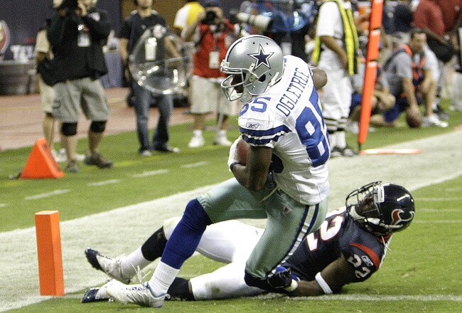 HOUSTON - AUGUST 28: Wide receiver Kevin Ogletree #85 of the Dallas Cowboys his tackled by cornerback Sherrick McManis #22 of the Houston Texans as he scores in the fourth quarter at Reliant Stadium on August 28, 2010 in Houston, Texas. Houston won 23-7. (Photo by Bob Levey/Getty Images)