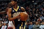 CHICAGO - FEBRUARY 24: T.J. Ford #5 of the Indiana Pacers moves past Loul Deng #9 of the Chicago Bulls at the United Center on February 24, 2010 in Chicago, Illinois. The Bulls defeated the Pacers 120-110. NOTE TO USER: User expressly acknowledges and agrees that, by downloading and/or using this Photograph, User is consenting to the terms and conditions of the Getty Images License Agreement. (Photo by Jonathan Daniel/Getty Images)