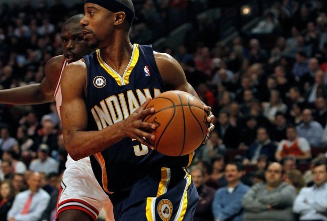 CHICAGO - FEBRUARY 24: T.J. Ford #5 of the Indiana Pacers moves past Loul Deng #9 of the Chicago Bulls at the United Center on February 24, 2010 in Chicago, Illinois. The Bulls defeated the Pacers 120-110. NOTE TO USER: User expressly acknowledges and agrees that, by downloading and/or using this Photograph, User is consenting to the terms and conditions of the Getty Images License Agreement. (Photo by Jonathan Daniel/Getty Images)