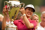 WINNIPEG, CANADA - AUGUST 29: Michelle Wie of the U.S. holds up the winner's trophy after her victory at the CN Canadian Women's Open at St. Charles Country Club on August 29, 2010 in Winnipeg, Manitoba, Canada. (Photo by Darren Carroll/Getty Images)