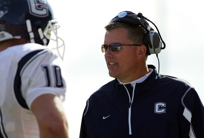 PISCATAWAY, NJ - OCTOBER 18:  Head coach Randy Edsall of the Connecticut Huskies talks with Zach Frazer #10 during a timeout against the Rutgers Scarlet Knights at Rutgers Stadium on October 18, 2008 in Piscataway, New Jersey. Rutgers defeated Connecticut 12-10.  (Photo by Jim McIsaac/Getty Images)