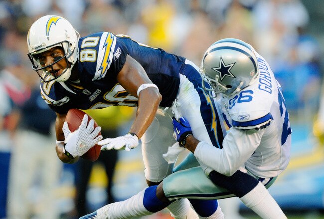 SAN DIEGO - AUGUST 21:  Wide receiver Malcolm Floyd #80 is wrapped up by Cletis Gordon #26 of the Dallas Cowboys during their pre-season NFL football game at Qualcomm Stadium on August 21, 2010 in San Diego, California.  (Photo by Kevork Djansezian/Getty Images)