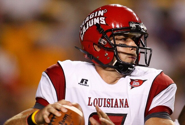 BATON ROUGE, LA - SEPTEMBER 19:  Quarterback Chris Masson #7 of the University of Louisiana-Lafatette Ragin' Cajuns looks to throw under pressure from Patrick Peterson #7 of the Louisiana State University Tigers at Tiger Stadium on September 19, 2009 in Baton Rouge, Louisiana.  (Photo by Chris Graythen/Getty Images)