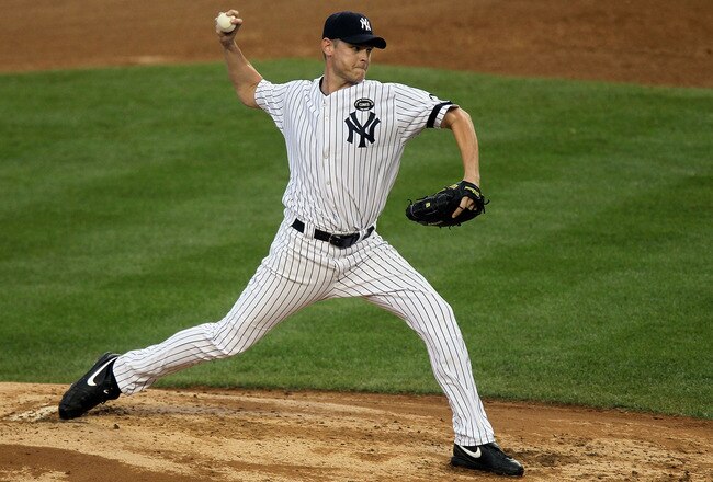 NEW YORK - AUGUST 22:  Kerry Wood #39 of the New York Yankees pitches against the Seattle Mariners on August 22, 2010 at Yankee Stadium in the Bronx borough of New York City.The Yankees defeated the Mariners 10-0.  (Photo by Jim McIsaac/Getty Images)