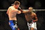 LAS VEGAS - JULY 11:  (R-L) Jon Jones connects with a right punch on Jake O'Brein during their light heavyweight bout during UFC 100 on July 11, 2009 in Las Vegas, Nevada. Jones defeated O'Brein by second round tapout.  (Photo by Jon Kopaloff/Getty Images)