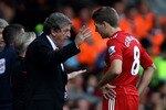 LIVERPOOL, ENGLAND - AUGUST 15:  Liverpool Manager Roy Hodgson issues instructions to Steven Gerrard during the Barclays Premier League match between Liverpool and Arsenal at Anfield on August 15, 2010 in Liverpool, England.  (Photo by Clive Brunskill/Getty Images)