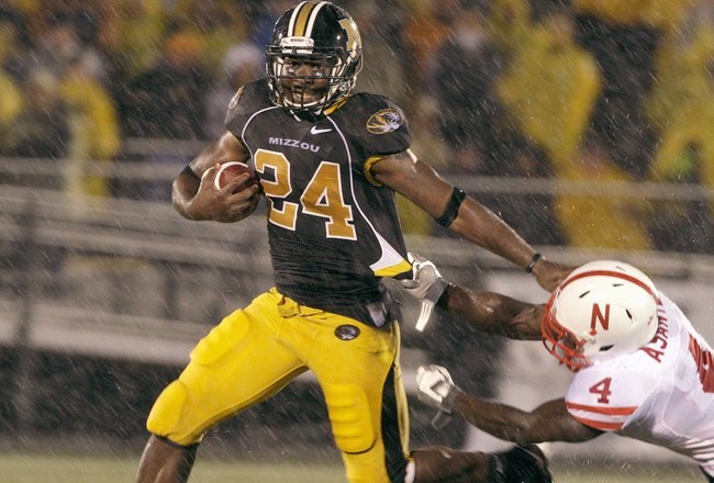 COLUMBIA, MO - OCTOBER 08:  Derrick Washington #2 of the Missouri Tigers carries the ball against Larry Asante #4 of the Nebraska Cornhuskers on October 8, 2009 at Faurot Field/Memorial Stadium in Columbia, Missouri. (Photo by Jamie Squire/Getty Images)