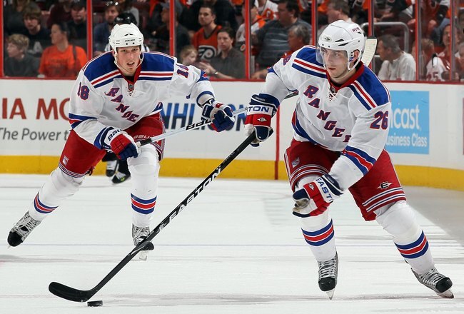 PHILADELPHIA - APRIL 11:  Erik Christensen #26 and Marc Staal #18 of the New York Rangers skate against the Philadelphia Flyers on April 11, 2010 at Wachovia Center in Philadelphia, Pennsylvania. The Flyers defeated the Rangers 2-1 after a shootout. The victory clinched a playoff berth for Philadelphia.  (Photo by Jim McIsaac/Getty Images)